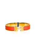 HERMES CLIC H BANGLE FEATURES BRIGHT ORANGE ENAMEL AND GOLD PLATED HARDWARE (EC00107LEBG)